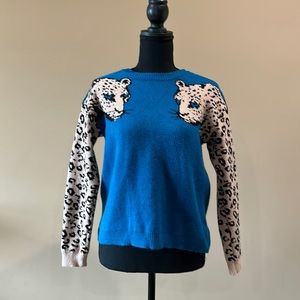 Boutique Sweater teal with leopard sleeves small. New without tags.